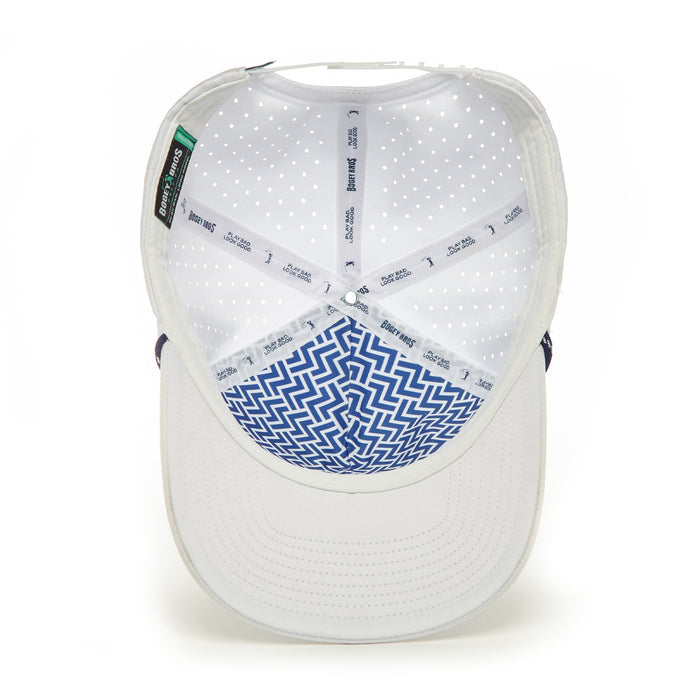 The '+1 - Performance Golf Rope Hat - Snapback' is a white cap with a blue and white zigzag brim, made from performance material. It features sweat stain resistant seams with printed white tape and ventilated crown perforations.