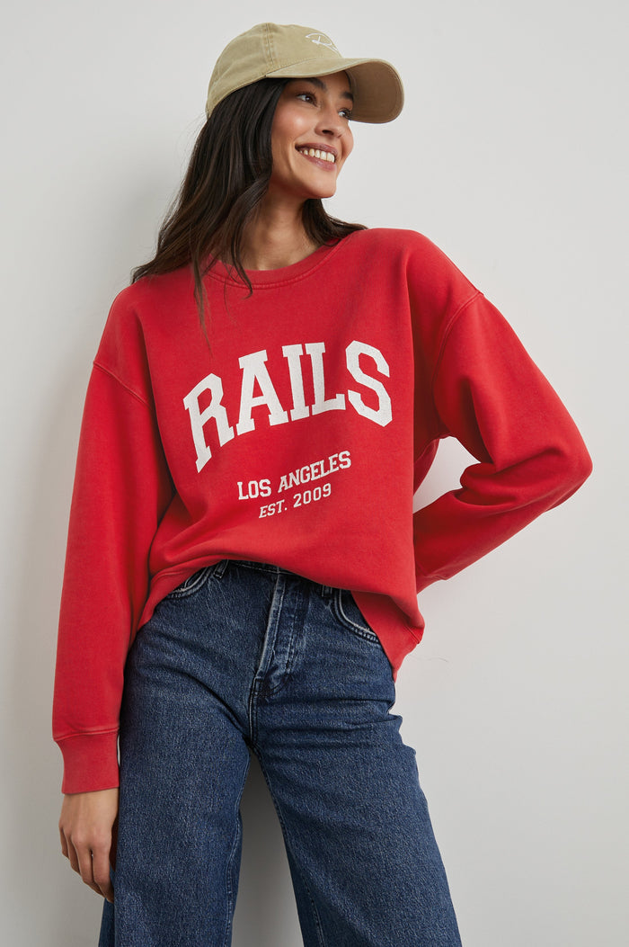 Anniversary Sweatshirt with Crewneck, Text States, Rails Los Angeles Est 2009, in Washed Red Colorway with White Letters - Front View Featured on Model