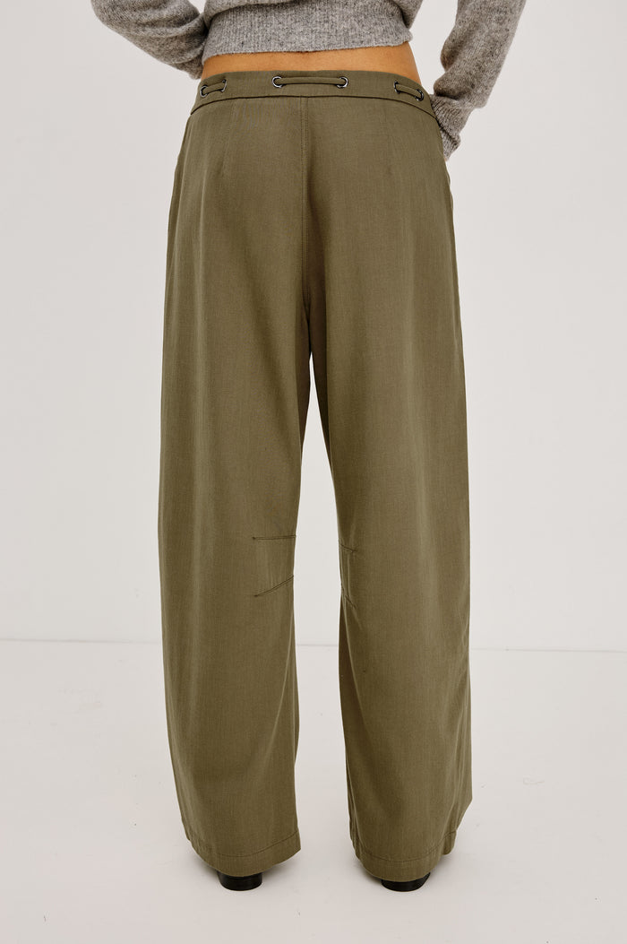 Barry Pant in Cotton Lyocell Denim With Wide Legs That Taper at Hem, Front Zip, Grommet Drawstring Waistband, and Side Slant Pockets in Olive Colorway - Lower Body Back View Featured on Model