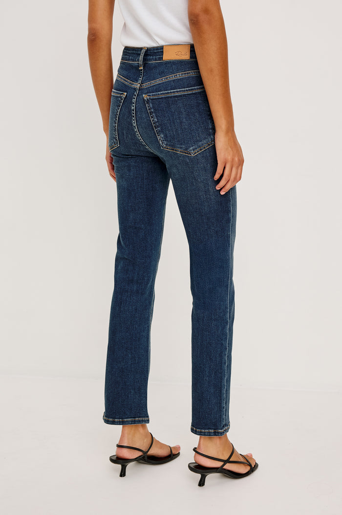 Bixby is a 5-pkt slim straight jean in Deep Dive colorway. Back view featured on model.