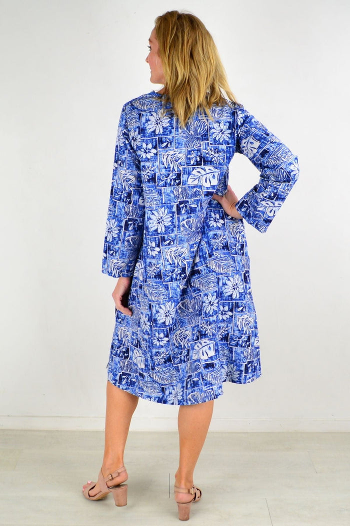 Hourglass Helens Hawaii linen tunic dress displayed on a hanger, showcasing lightweight, breezy fabric and relaxed fit.