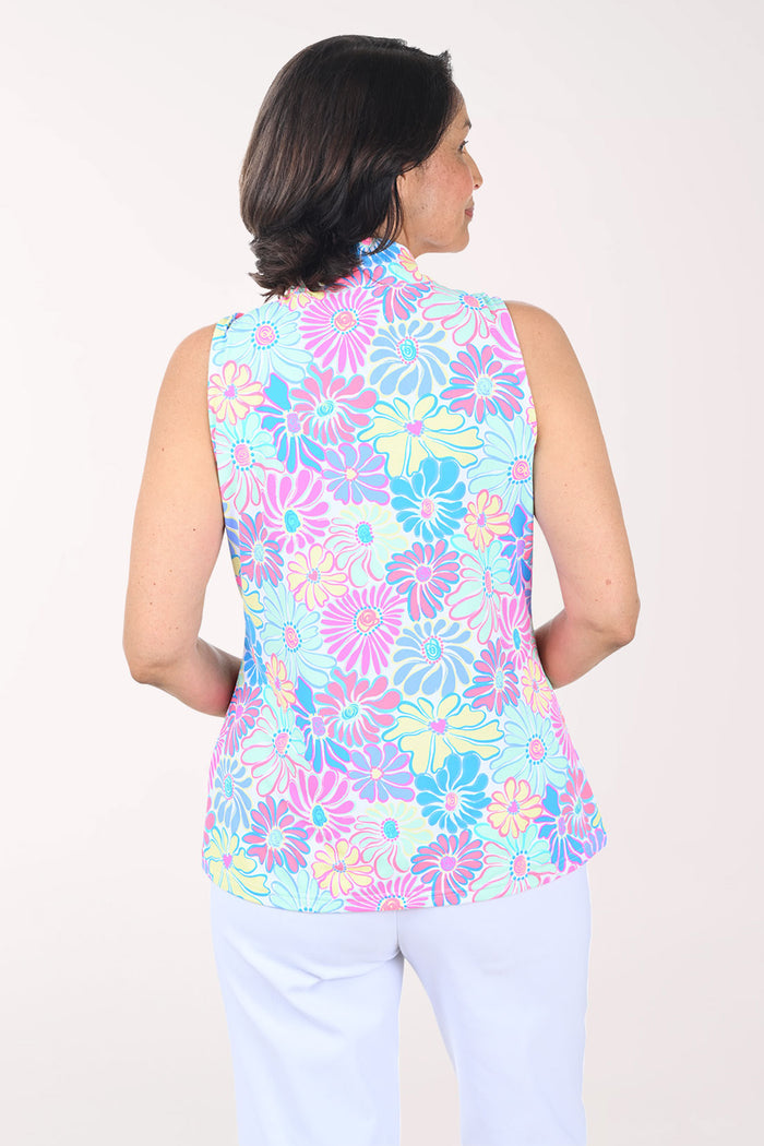 Woman wearing a multicolored sleeveless zip-up top