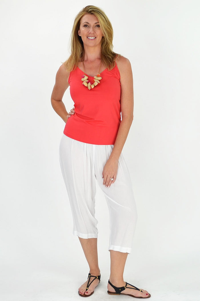 Relaxed white rayon pants by Kita Ku displayed on a model, showcasing casual, comfortable pants with a loose fit.