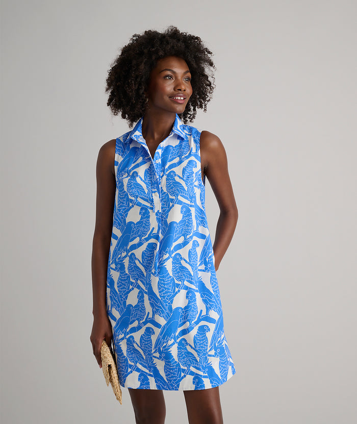 Model is wearing UNTUCKit Jordan printed birds dress in blue.