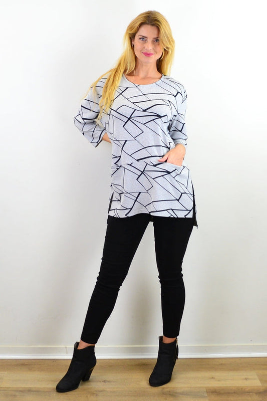 Caroline Morgan abstract lines print tunic top with a relaxed fit, featuring a modern geometric design and long sleeves.