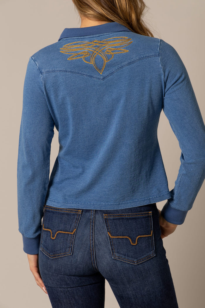 Woman in blue shirt with embroidered design, unnamed-196.
