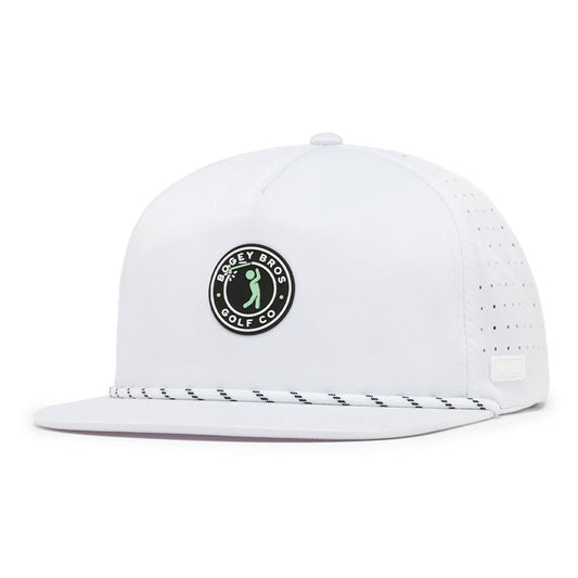 The Bogeyman Stamp White Unstructured Flat Bill Hat is a snapback with performance material, a circular black-and-white Bogey Bros Golf Co. logo on the front, perforated side holes, and a black-and-white patterned rope above the brim.