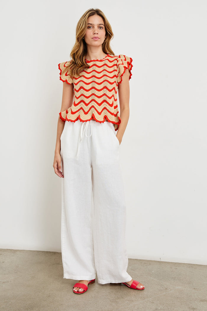 Coen Crochet Knit Short-Sleeve Top with Flared Sleeves and a Back Keyhole Tie in Cherry Oat Stripe Colorway, Horizontal Wavy Stripes - Front Full Body View Featured on Model