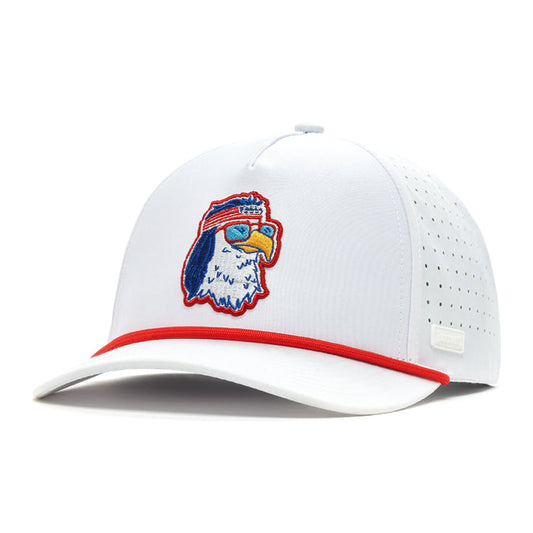 The FREEagle Performance Golf Rope Hat is a white snapback with red brim trim, a perforated back, and sweat-resistant fabric. The front features an embroidered eagle head with red sunglasses and headband, outlined in blue and yellow.