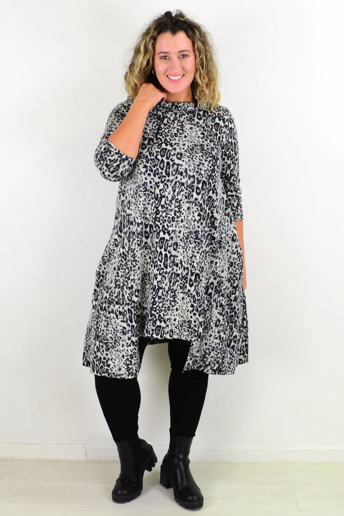 Leopard print fleece tunic dress from Hourglass, featuring a relaxed fit and cozy fabric, ideal for casual wear.