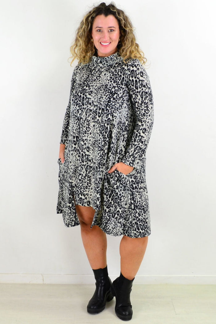 Leopard print fleece tunic dress by Hourglass, featuring a cozy, relaxed fit with long sleeves and a stylish animal pattern.
