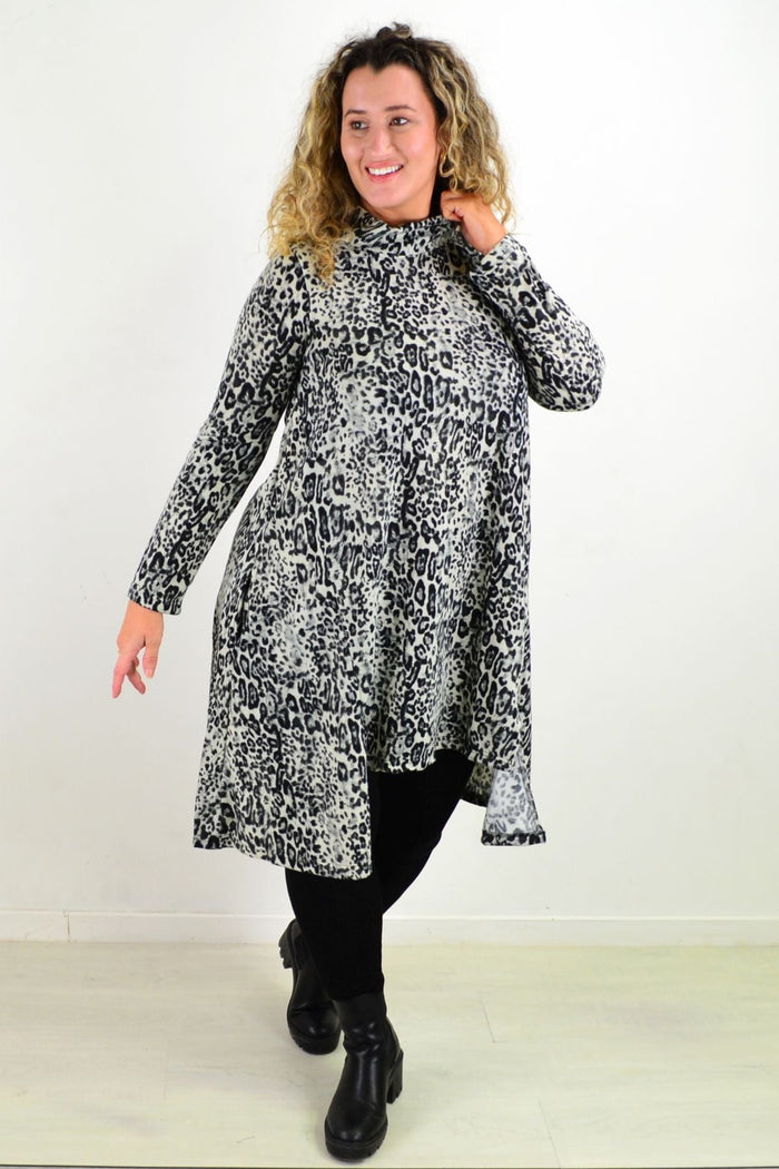 Leopard print fleece tunic dress by Hourglass, featuring a cozy, long-sleeve design with a relaxed fit and stylish animal pattern.