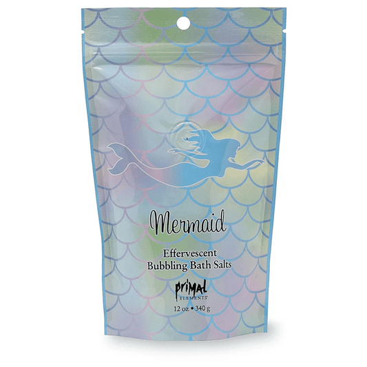 Packaging of Mermaid Bubbling Bath Salts | Primal Elements featuring a colorful mermaid scale pattern and a mermaid silhouette, designed for body care and skincare wellness.