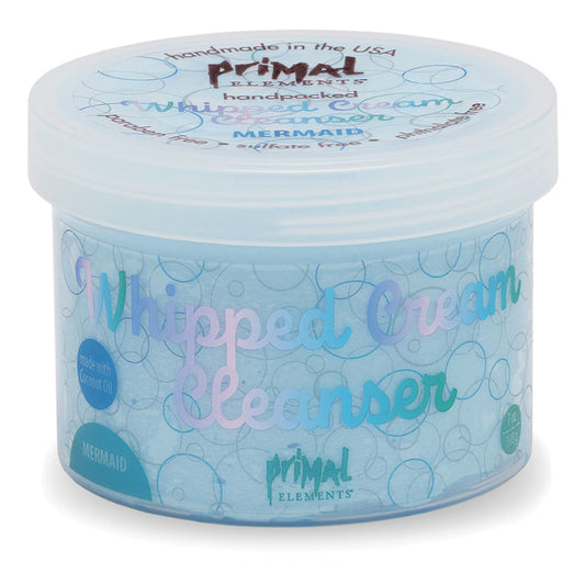 Mermaid Whipped Cream Cleanser | Primal Elements in a light blue container with pastel-colored text and bubbles, designed for gentle skincare and cleansing.