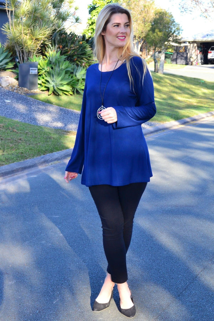 Navy button-up long sleeve tunic top by Lilia, basic and versatile with a relaxed fit and classic collar, shown on a mannequin.