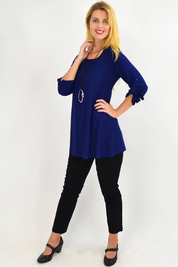 Navy button-up long sleeve basic tunic top by Lilia, featuring a relaxed fit and classic collar, displayed on a hanger.