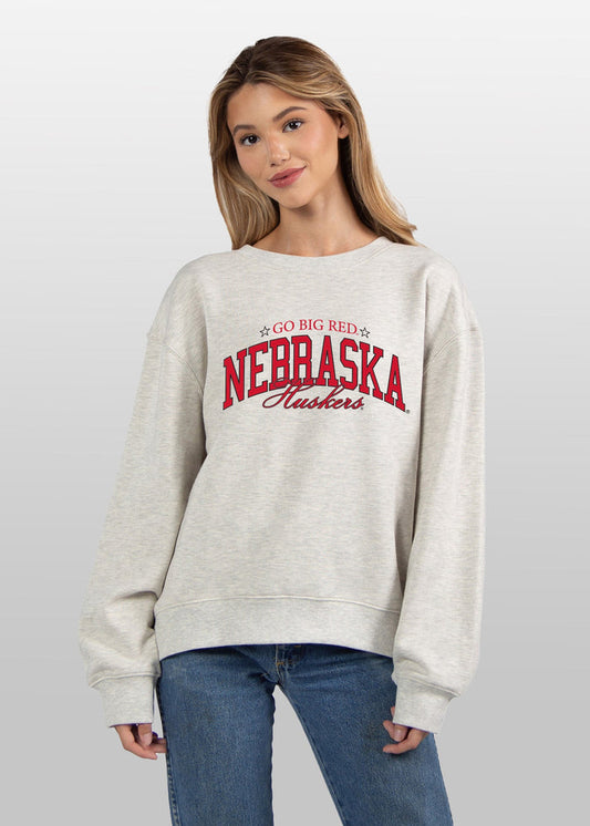 Nebraska Cornhuskers Women's Ash-Grey Relaxed Heavyweight Fleece Sweatshirt with Dropped shoulders, crew neckline, back center seam and ribbed neckline, cuffs and hem