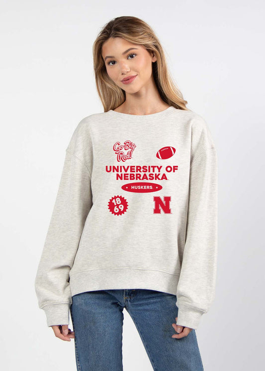 Nebraska Cornhuskers Women's Ash-Grey Relaxed Heavyweight Fleece Sweatshirt with Dropped shoulders, crew neckline, back center seam and ribbed neckline, cuffs and hem