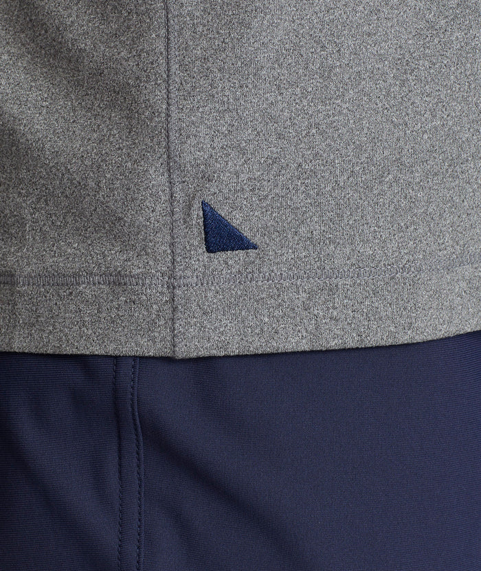 Model is wearing UNTUCKit Clavidor polo in gray.