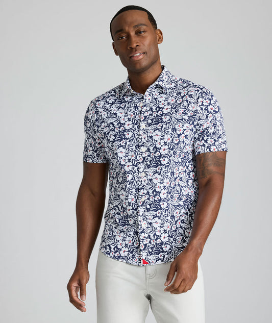 Model is wearing UNTUCKit Conner performance shirt in navy print.
