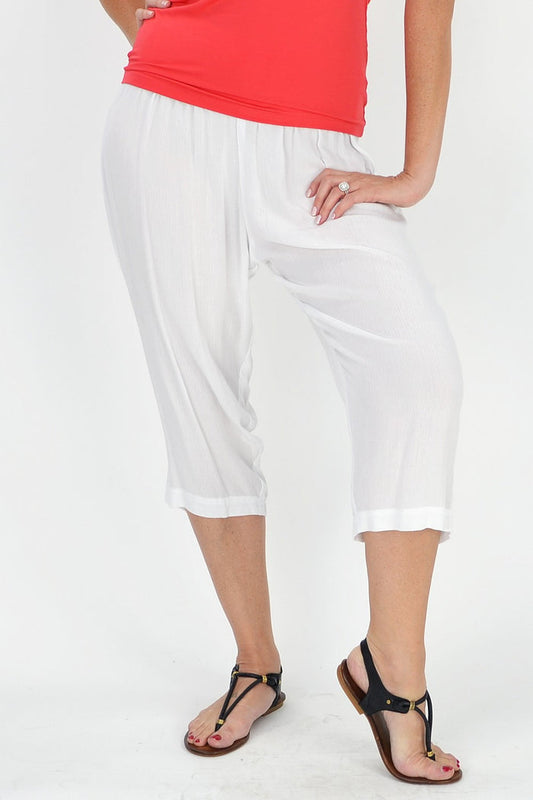 White relaxed rayon pants by Kita Ku, featuring a comfortable fit and casual style, shown on a model.