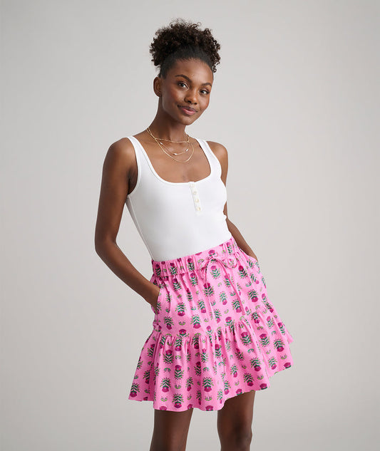 Model is wearing UNTUCKit Ilona skirt in pink.