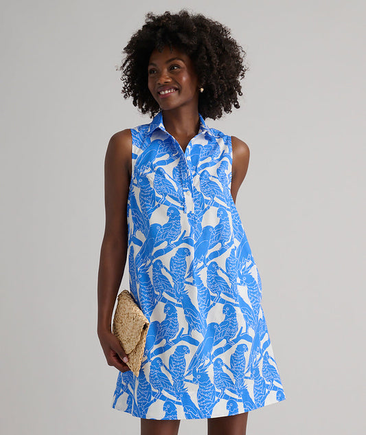 Model is wearing UNTUCKit Jordan printed birds dress in blue.