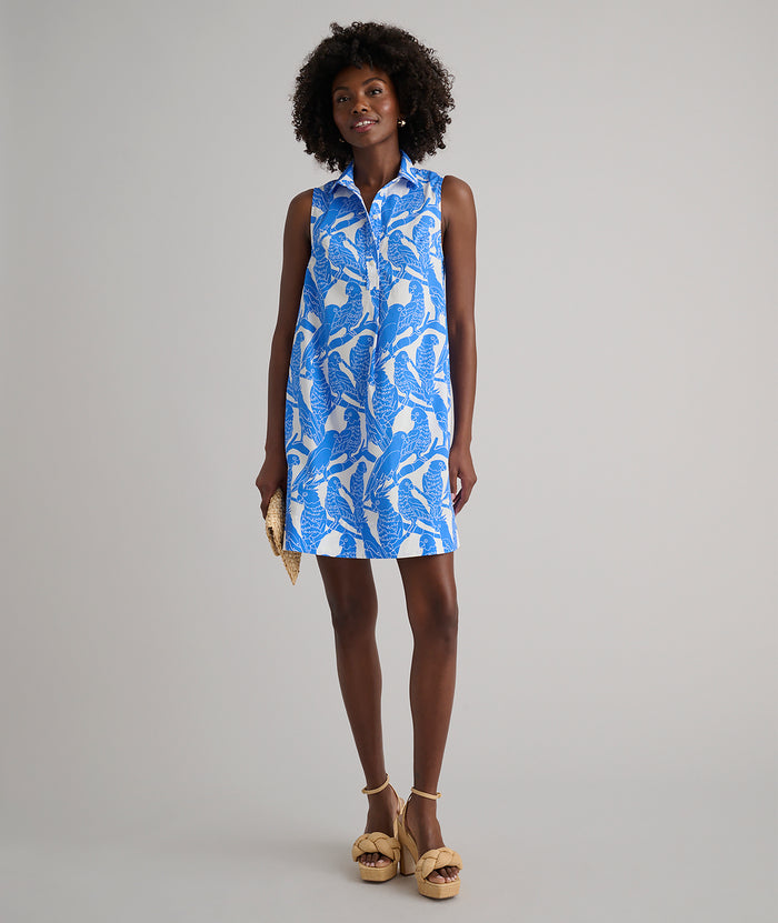 Model is wearing UNTUCKit Jordan printed birds dress in blue.
