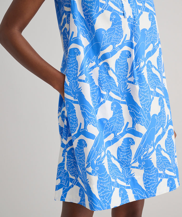Model is wearing UNTUCKit Jordan printed birds dress in blue.