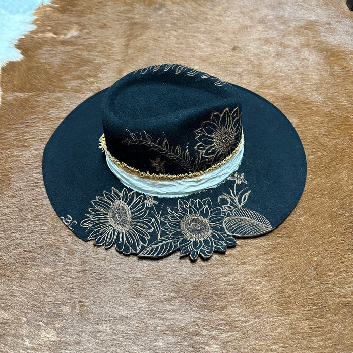 Black hat with sunflower designs.