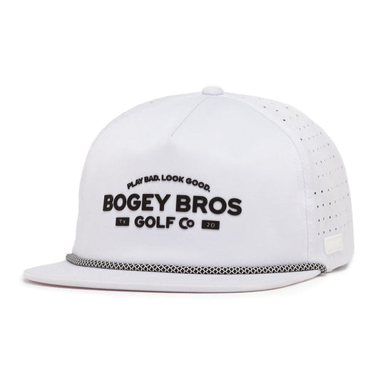 The TX20 Unstructured Flat Bill Hat is a white performance snapback with perforated sides and a black-and-white rope. Bold black "BOGEY BROS GOLF CO" and "PLAY BAD. LOOK GOOD." are displayed on the front.