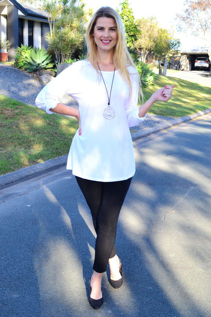 White Lilia button-up long sleeve tunic, a basic blouse with a classic collar and clean design, perfect for casual or professional wear.