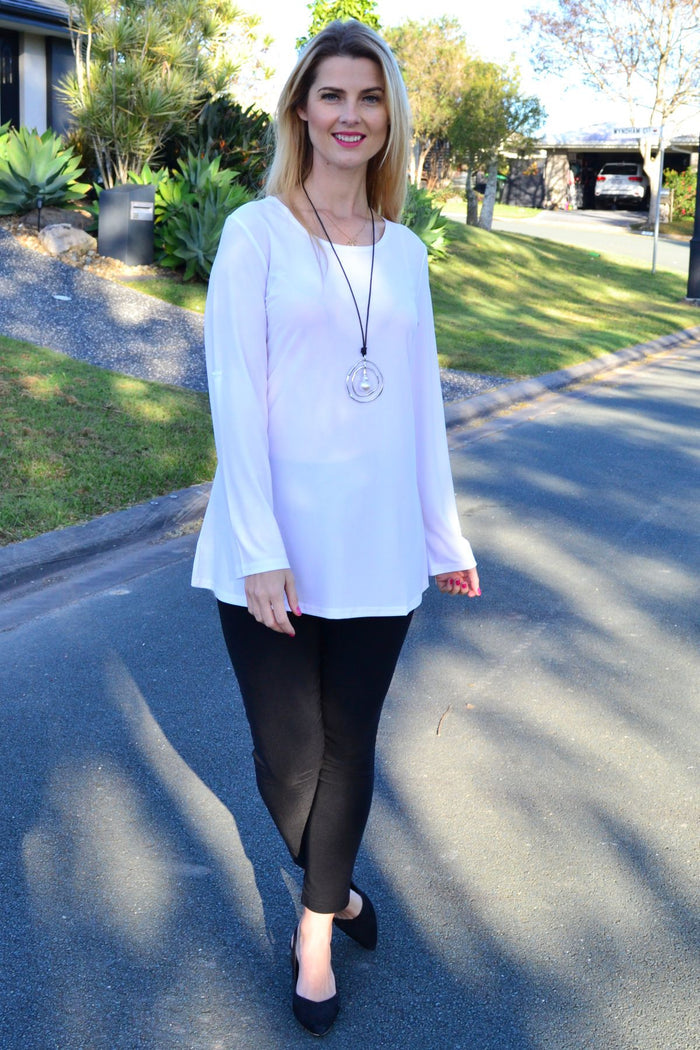 White Lilia button-up long sleeve basic tunic, showcasing a classic fitted design with a collared neckline and button front.