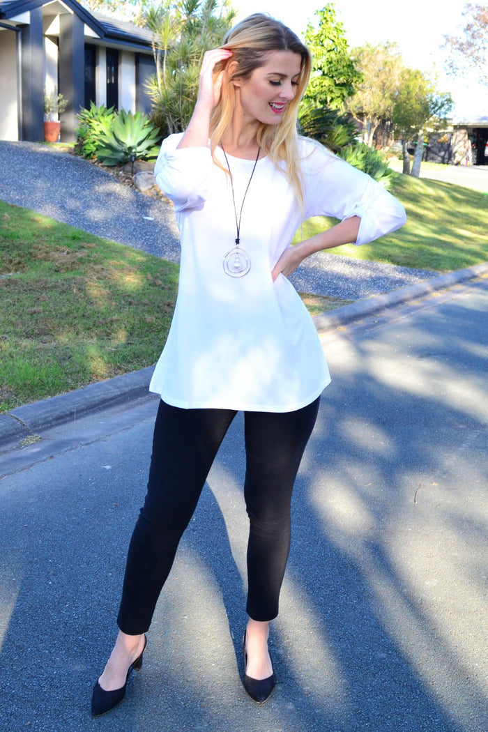 White Lilia basic long sleeve button-up tunic, casual and versatile top with a classic collar and front buttons.