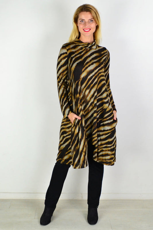 Hourglass Wild Side Fleece Tunic Dress shown in a cozy fleece fabric, with a relaxed fit and stylish design.